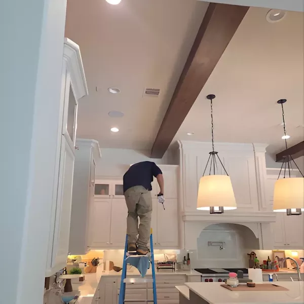 R-32 GLXS4M installation technician inspecting ceiling vent and HVAC components during system setup